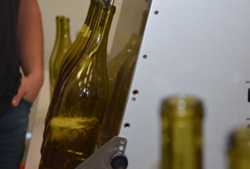 The bottling process of Cal Poly wine in the pilot center. Credited by: Andi DiMatteo