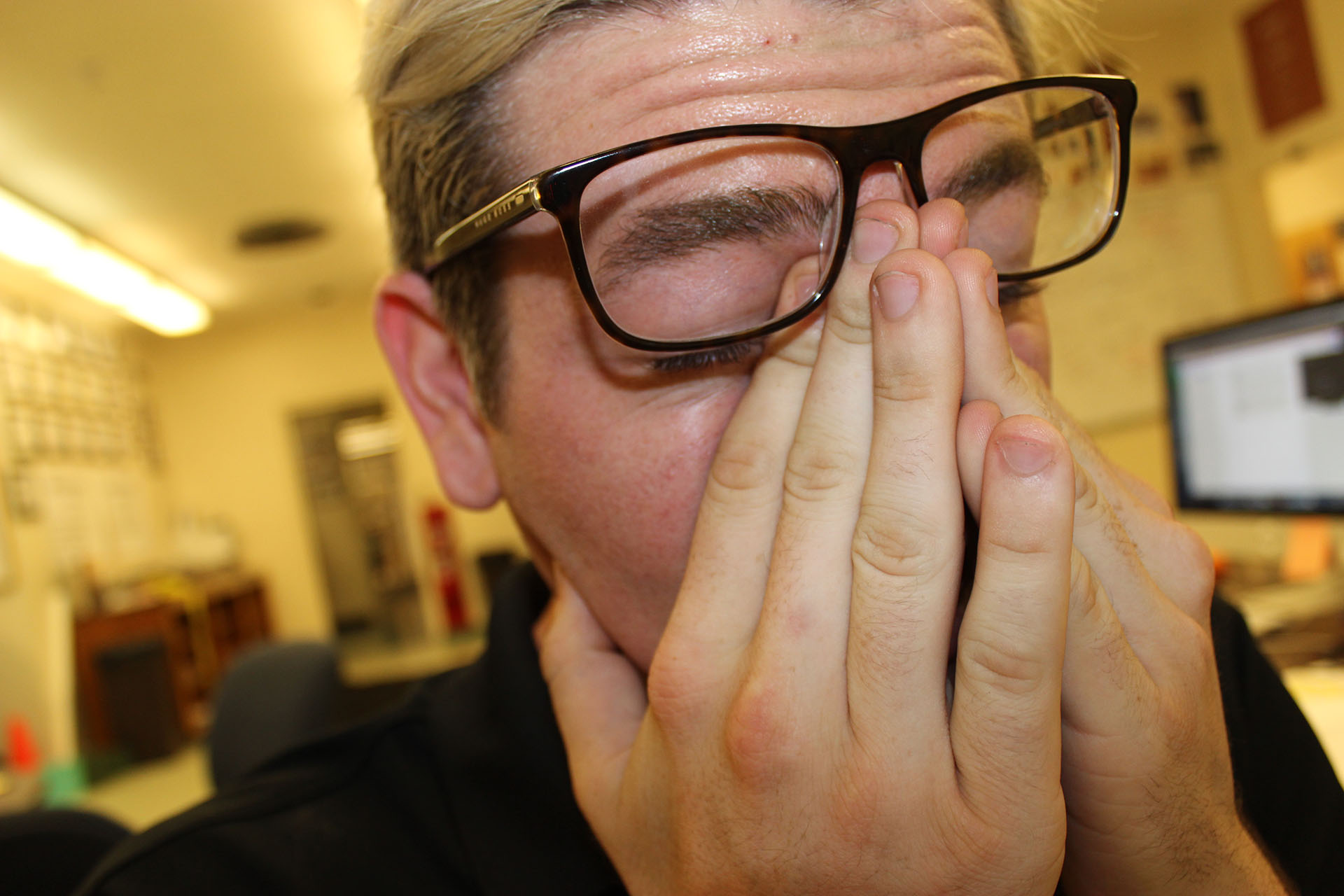 Tired Eyes - Staring at a computer screen has taken a toll on Dunn as he rubs his eyes with exhaustion. There is a sense relief as he adjusts his glasses knowing the newspaper designs are finally in production at the press. Journalism senior Alexa Bruington, one of Dunn’s best friends comments on his work ethic. “He does so much between Mustang News and school I’m shocked we still have time to hang out,” she said.