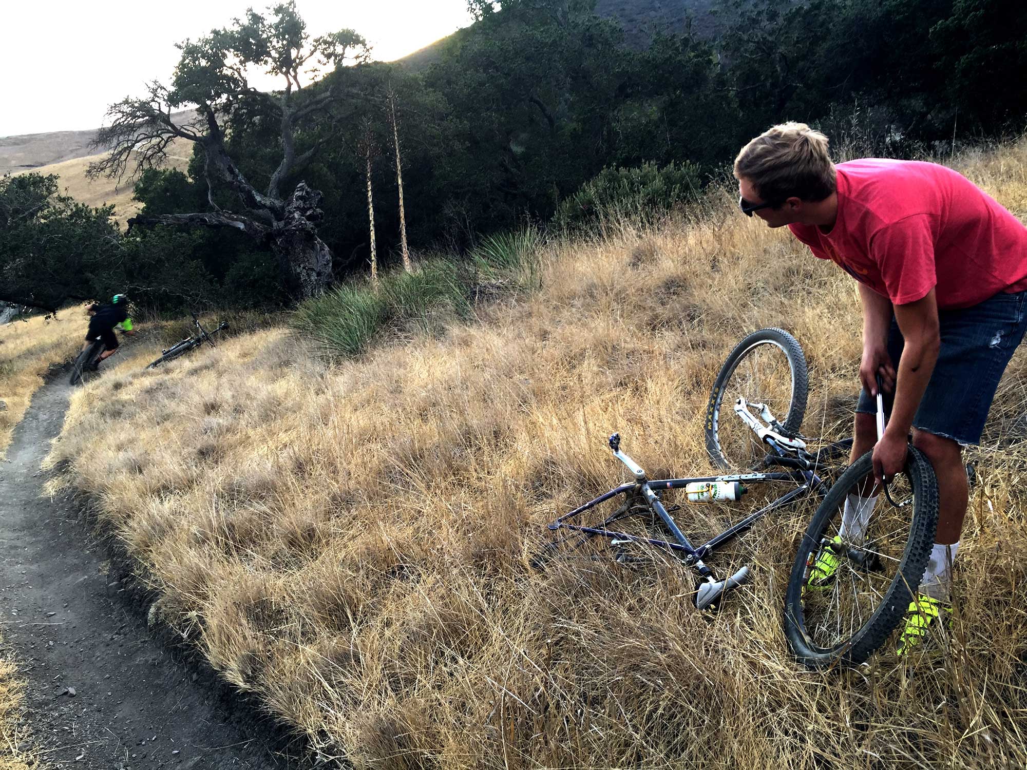 Oct. 7, 2016 – For Michael Beard, a general engineering sophomore at Cal Poly, it has been a difficult run on Hawaii Friday. During the past two weeks, Beard has encountered mechanical issues. While perched in Poly Canyon’s weeds, he inflates a flat tire. During maintenance, Beard spoke of a recent sell. 'Someone got a sweet bike for $100, after we flipped it and made $80. It was only $15 for all of the parts,' Beard said. He’s not opposed to work; however, dreaming of unencumbered singletrack, Beard watches Ryan Miller zoom towards the sunset. Miller, a mechanical engineering junior at Cal Poly, is Cal Poly Cycling’s vice president.