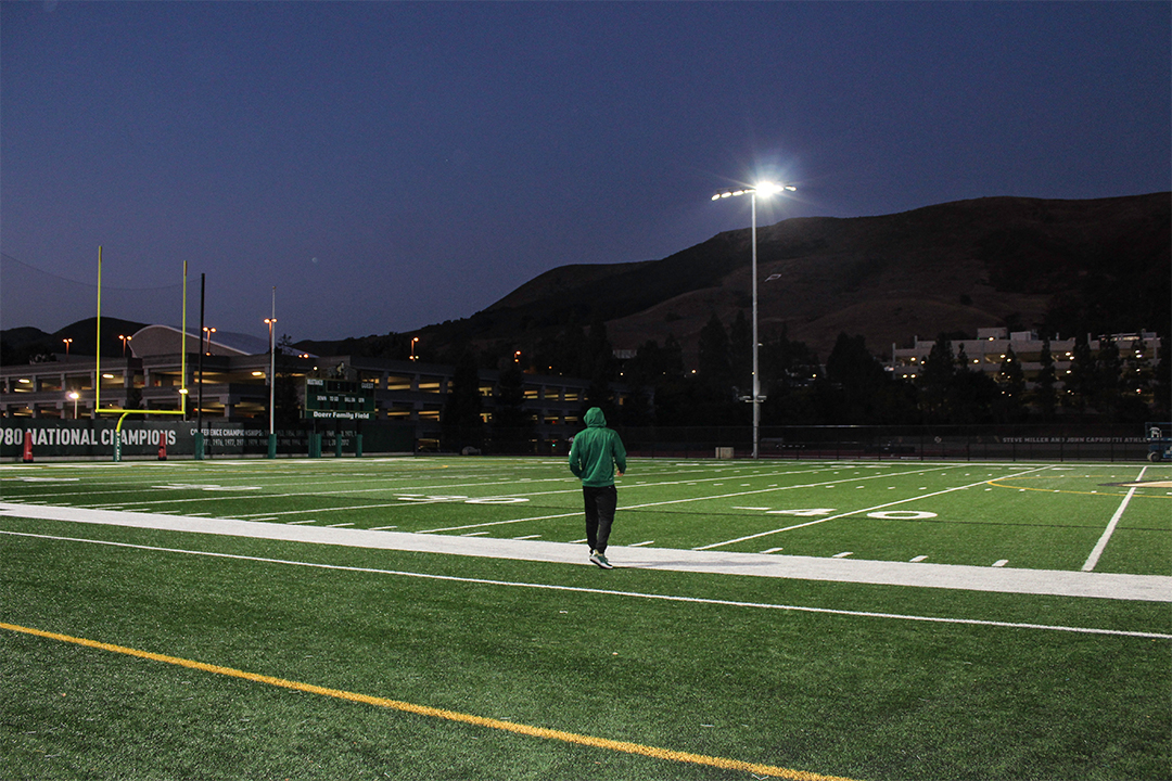 After a full day of classes and mandatory team meetings, at 7 p.m., Kitu heads to the practice football field to run drills by
himself. He uses this time to clear his head, he finds it therapeutic. 
