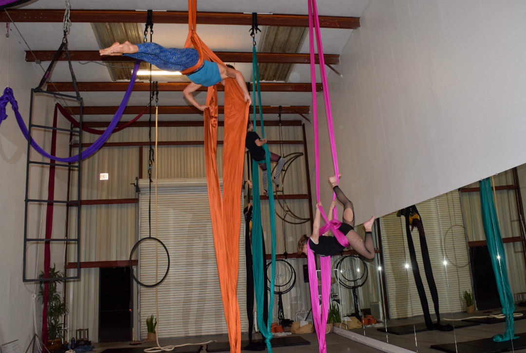 Practicing for a Halloween-themed aerial dance show, Cheyenne Miller, Julia Nowak, Nikki Pesce and Jamie Relth practice their suspended moves at Levity Academy in San Luis Obispo on Oct. 5. “It’s a form of self expression, and for me it epitomizes strength, grace and beauty wrapped up into one,” co-owner GiGi Penton said.