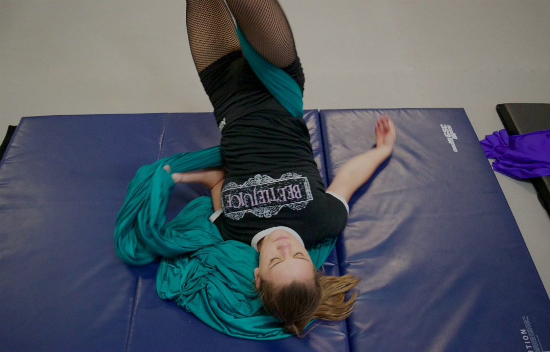 Cheyenne Miller attended an hour-long aerial class before heading straight into rehearsal for the show. She has also been working on a solo dance piece for the show that she choreographed. Coming out of a move, Miller untangles herself from the silk.