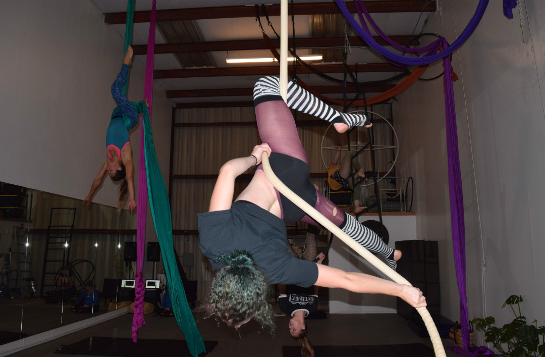 Nowak completes the move with a full spin. “Especially with the more advanced students, we’re all learning together and teaching each other,” Hampsey said. “Anyone can do aerial. It looks intimidating, but you can definitely pick it up.”