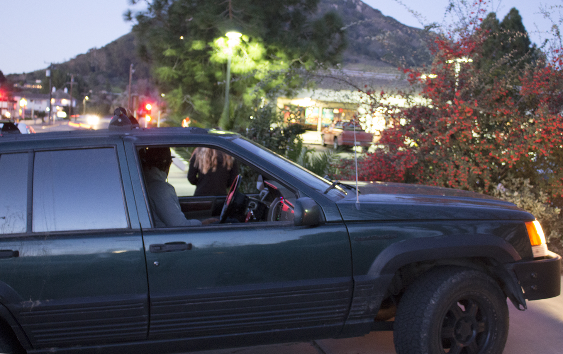 <strong>Early start</strong> – Cal Poly parks and recreation freshman Taylor Mathiesen waits inside his Jeep at 6:30 a.m., in economics junior Adam Redding-Kaufman's driveway, on the Wednesday of week three of Cal Poly’s winter quarter. Redding-Kaufman is inside, gathering more members of the team to head outside.