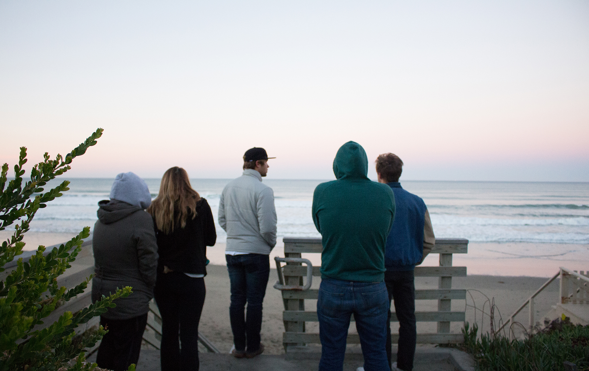 <strong>Gazing out</strong> – Five members of the Cal Poly surf team check out the surf at 7 a.m. Wednesday morning of week three of Cal Poly's winter quarter. Despite having class that day until 8 p.m., Mathiesen (middle) came out with the team. “[I’m] passionate about surfing and want to be able to do it for the rest of my life. [Surfing] is one of the reasons I came to Cal Poly. I have the opportunity now to make use of the education and might as well get stoked to surf good waves,” he said.