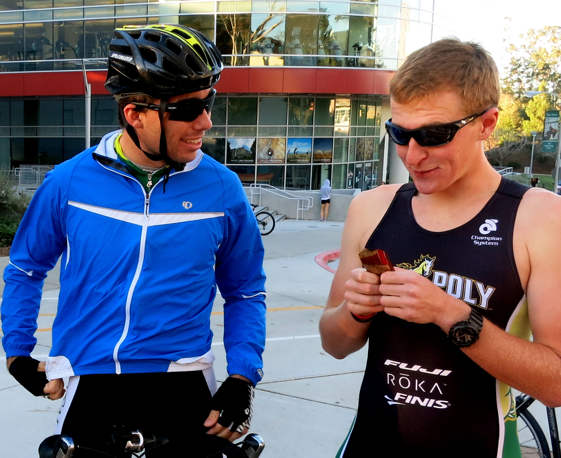 Sean Sullivan, at left, a third-year biology major and the student bike coach, chats with Isaac Blundell, a second-year aerospace engineering major, as he powers up in preparation for the race.  Blundell achieved the fastest bike time of the day, despite losing one of his handlebars within the first 500 feet of the ride.  Equipment malfunctions are one of the triathlete’s worst fears: “Having your equipment not functioning properly can be very frustrating, and focusing on it too much can be detrimental to your performance,” says Blundell.
