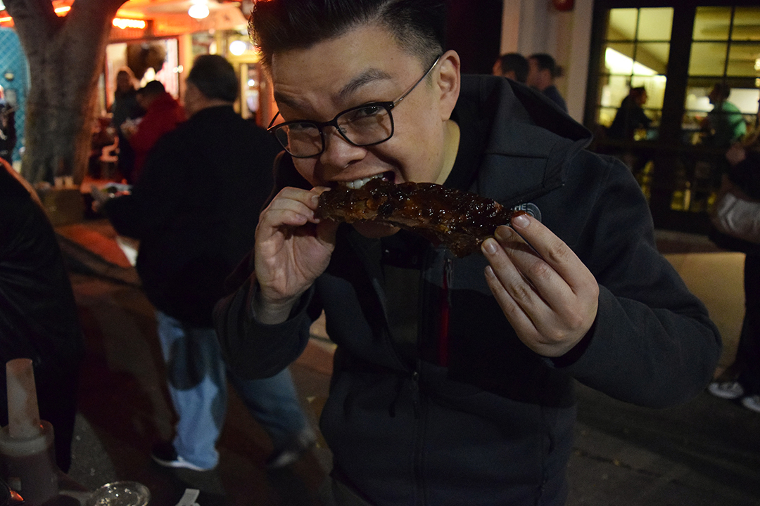 Marc declined to give his last name but dug into his F. Mclintocks ribs with great enthusiasm. “It was loud, and the line was super long. Long lines draw people and that usually means the food is good,” he said. Photo Credit: Monique Geisen