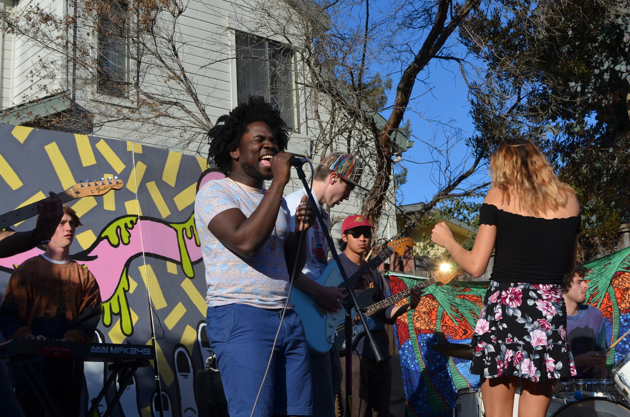 SubSessions most recent event – a Backyard Pop-up Shop, took place on March 18, 2018. The event included art and merchandise booths as well as live music. Pictured here, is a performance at the event by musician and student Hakeem Sanusi. 
 Photo Credit: Carter Harrington